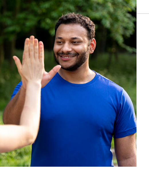 A person giving a high five to another person